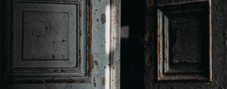 Beat up doors, standing open